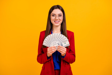 Photo of classy attractive business lady hold hand fan bucks money rich successful worker wear specs red luxury office blazer blue blouse suit isolated yellow color background