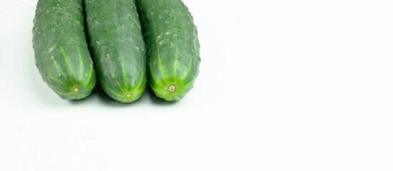 three cucumbers isolated on a white background
