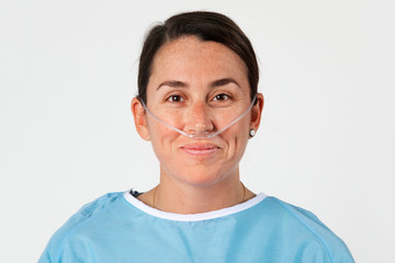 Sick female patient with a nasal cannula