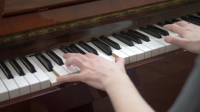 closeup. female hands masterfully play the arpeggio on the piano