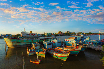 Fototapeta na wymiar A group of fishing boats and incredible sky in the evening in Thailand