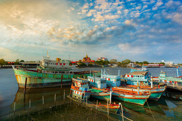 Fototapeta na wymiar A group of fishing boats and incredible sky in the evening in Thailand