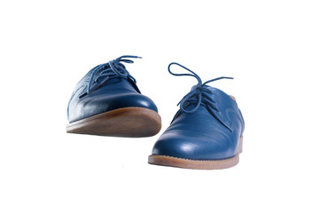 Blue leather shoes in perspective and isolated on white