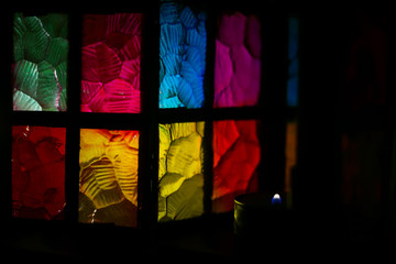 stained glass multi-colored glass of a beautiful lantern with a burning candle