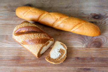 long loaf and marbled bread on a wooden table