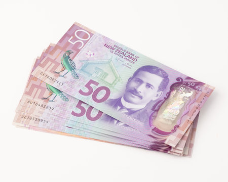 Closeup Stack of New Zealand 50$ Dollar banknotes on white background with copy space for text