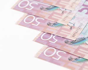 Closeup Stack of New Zealand 50$ Dollar banknotes on white background with copy space for text