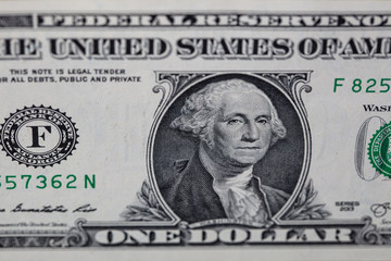 Closeup of front side of 1 dollar bill