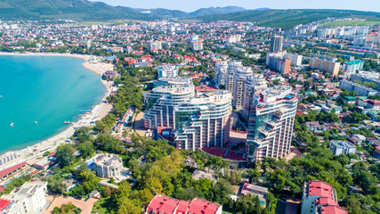 Residential multi-storey complex on the shore of Gelendzhik Bay, Gelendzhik resort on a clear Sunny day. From a bird's eye view