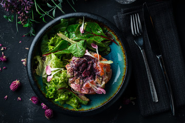 Tasty salmon and avocado tartar, dark background