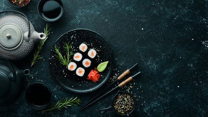 Sushi maki with salmon. Pieces of delicious sushi. Japanese cuisine