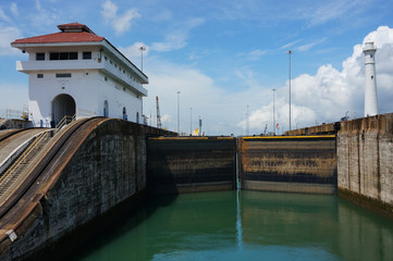 Lock closing. Gatun locks and Lighthouse. Panama Canal, Panama.