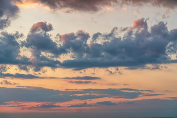 orange sunset sky with lighted clouds