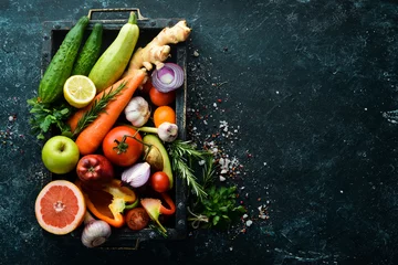 Fotobehang Fresh vegetables and fruits in wooden box. Organic food. © Yaruniv-Studio
