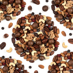 On an isolated background, different nuts are placed in a circle. Close-up. view from above.