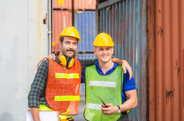 Happiness and smiling engineer and worker team standing with hands on shoulders and looking forward