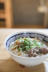 Ramen Japanese noodle soup food with noodle and pork on wooden table