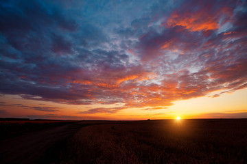 Perfect red clouds illuminated by the beams of the sun.
