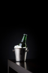 Beer bottle in an ice bucket