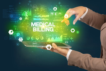 Close-up of a touchscreen with MEDICAL BILLING inscription, medical concept