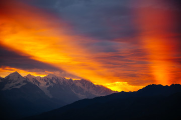Fantastic brilliant sunrise with rays breaking through the clouds. Location place of  Upper Svaneti, Georgia country.