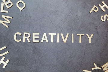 Wood text "Creativity" on back background for Business concept.