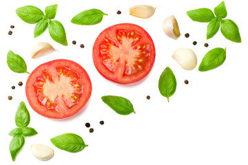 tomato slices with garlic and basil isolated on white background, top view