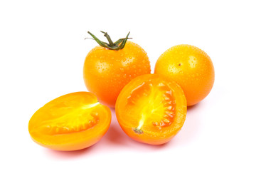 Yellow fresh tomatoes isolated on white background in close-up