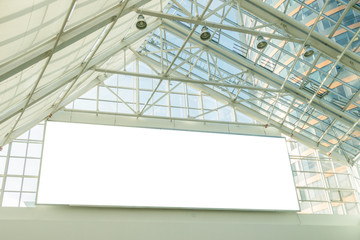 Blank white horizontal billboard signboard in the top of open shopping mall area
