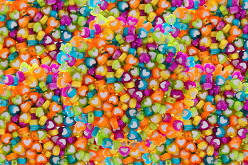 Fototapeta na wymiar multiple colorful heart beads background
