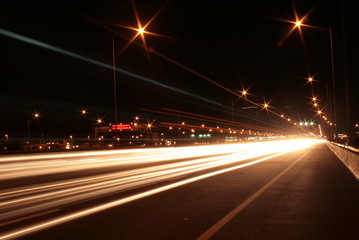 Fototapeta na wymiar traffic on the highway at night lighting