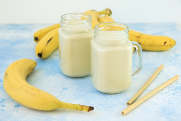 Healthy yogurt or smoothie with banana, vegetarian food, diet and healthy concept