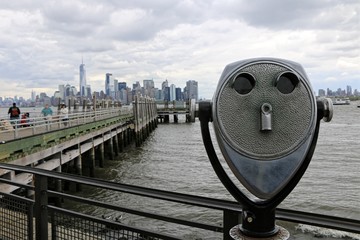 New York, United States. On Liberty Island with the skyline of Manhattan on background.