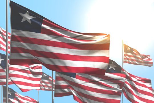 beautiful any occasion flag 3d illustration. - many Liberia flags are waving on blue sky background