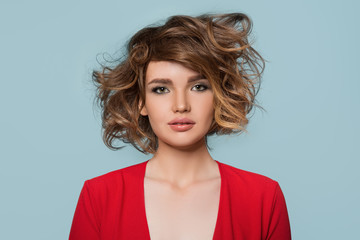 mess on the head. Tangled hair. Woman in red. portrait.