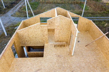 Construction of new and modern modular house. Walls made from composite wooden sip panels with...