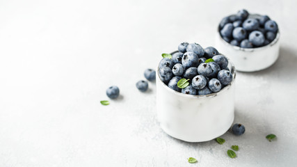 Fresh blueberries on a small ceramic bowl. Selective focus,copy space.