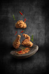 Flying spicy fried chicken © ludfi