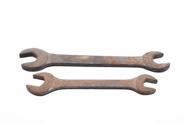 Old rusty wrench isolated on white background. 