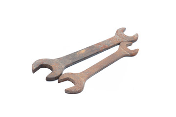 Old rusty wrench isolated on white background. 