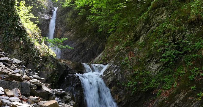 Three-stage waterfall in the spring in the mountains