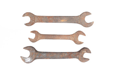 Old rusty wrench isolated on white background. 
