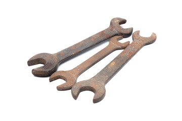 Old rusty wrench isolated on white background. 