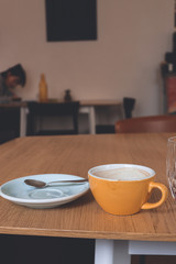 empty plate on the table/cup of coffee in the coffeeshop