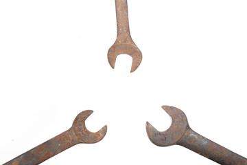 Old rusty wrench isolated on white background. 