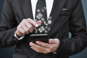 Closeup of businessman holding mobile phone with (calling, email, address) icon. Idea for connection social media in smartphone.