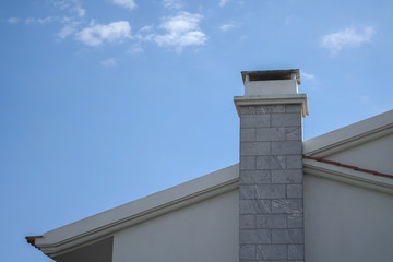 Chimney of the house with the bricks