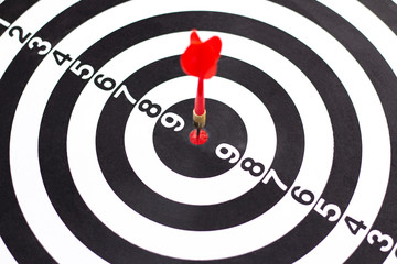 Dartboard with hit bullseye on white background, closeup. Bullseye is a business target. Target concept