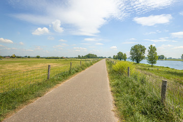 Endless path along a Dutch river in springtime