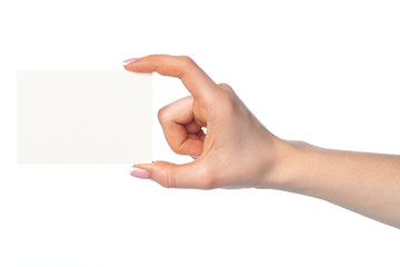 Woman's hand with blank white business card isolated on white